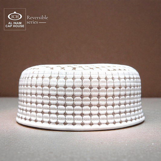 Front view of AL INAM ICH Reversible Islamic Prayer Cap in white premium cotton fabric with elegant geometric detailing and refined traditional finish.