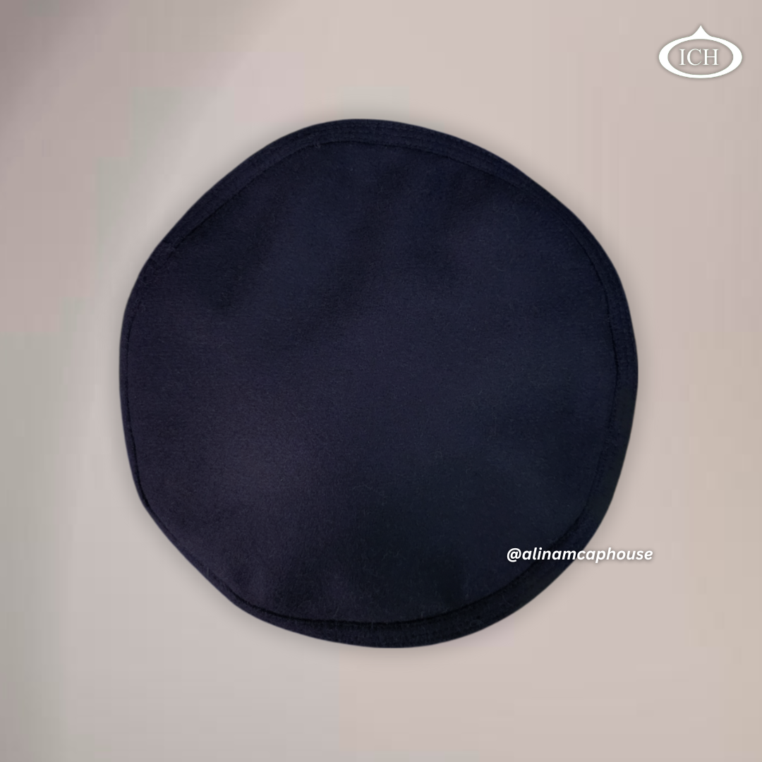 Dark blue Islamic Kabuli topi, top view, smooth blazer texture, circular pattern