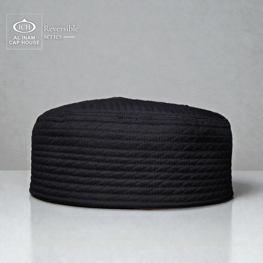 Front view of AL INAM Black Reversible Islamic Prayer Cap A-12 crafted from premium breathable cotton fabric with dual-sided design, elegant embroidery and lightweight kufi skull cap for Muslim men, ideal for namaz, Jummah prayer, Eid, Umrah and everyday Islamic wear.