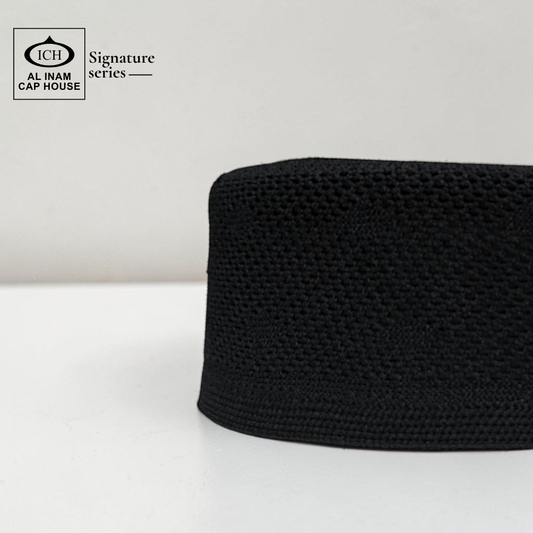 Side profile view of AL INAM Black Islamic Prayer Cap showing structured fit, clean stitching and breathable cotton material for comfortable skull cap wear.