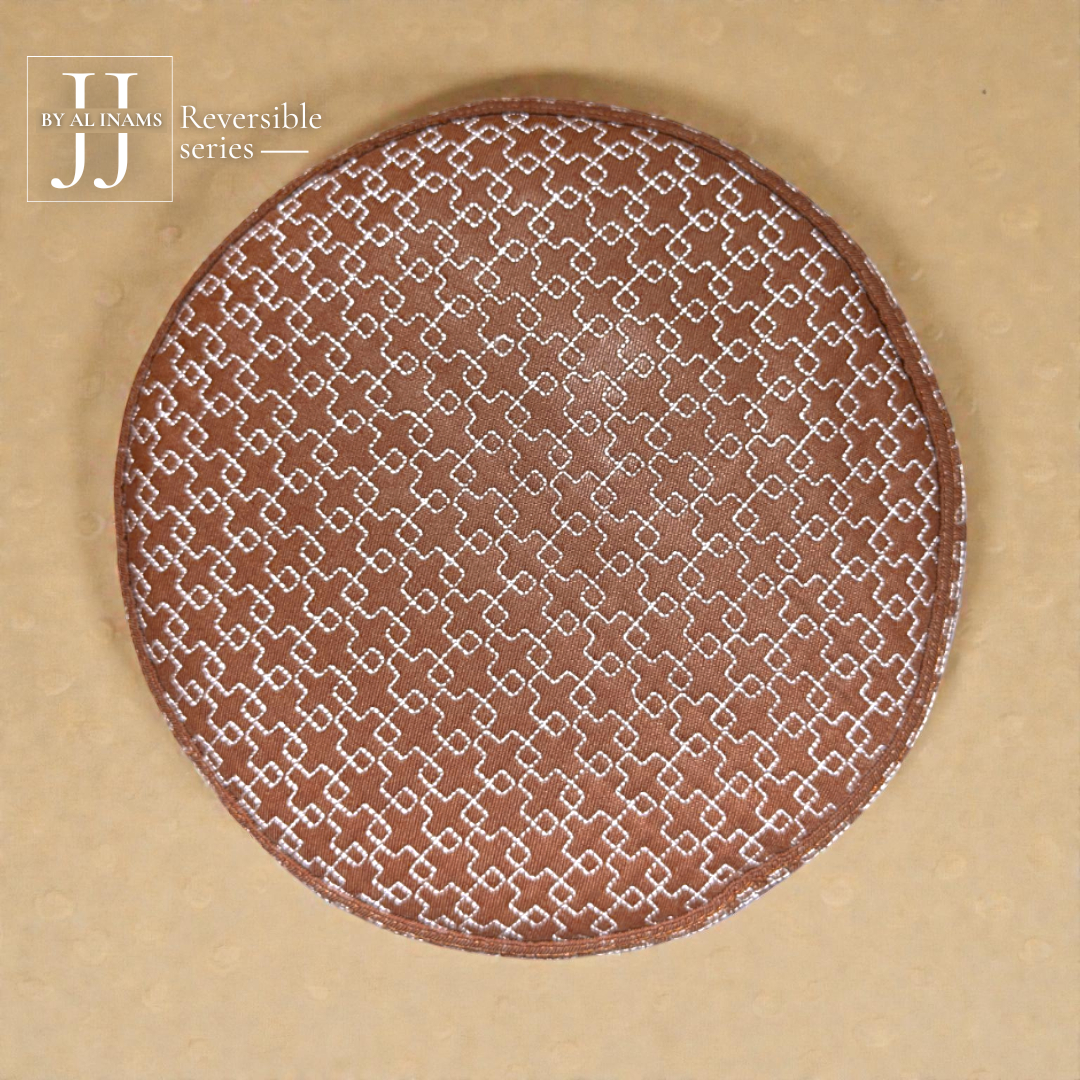 AL INAM CAP HOUSE A21 JJ style reversible Islamic prayer cap, top view displaying circular geometric embroidery on premium brown fabric