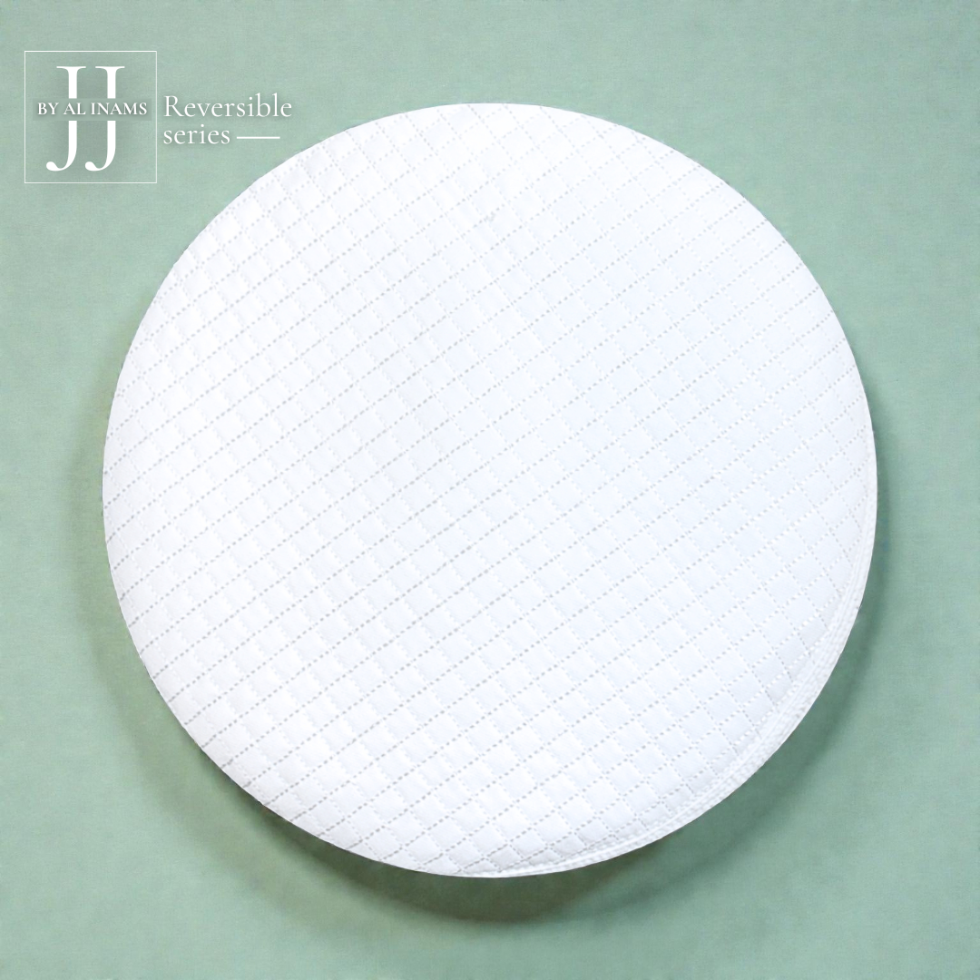 Top view of A23 JJ reversible white Islamic prayer cap from AL INAM CAP HOUSE, displaying balanced circular stitch design