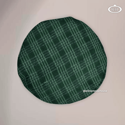 green Islamic Afghani topi, circular top view, textured fabric, prayer cap