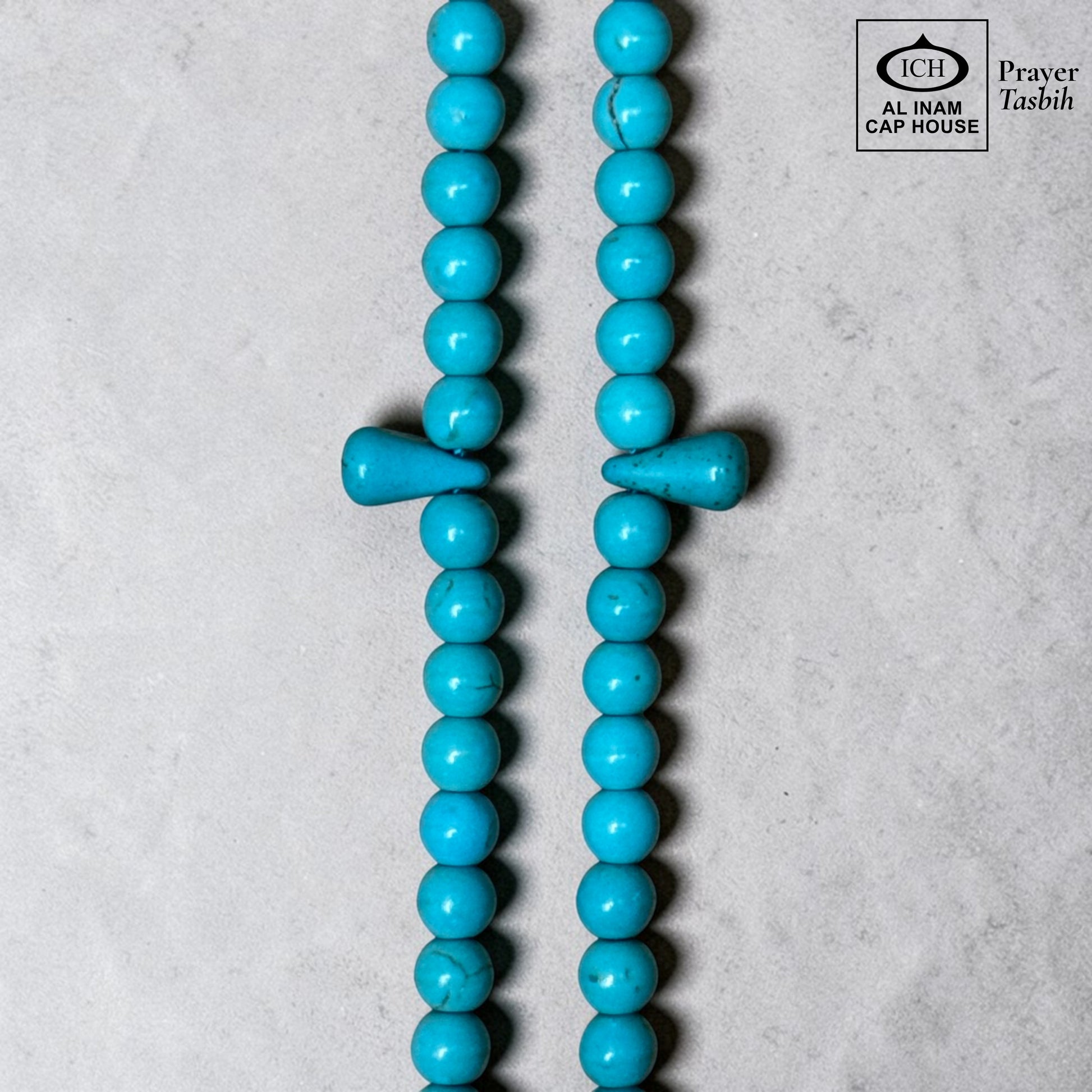 AL INAM CAP HOUSE Firoza Tasbih prayer beads made of polished turquoise stones with a unique teardrop-shaped marker bead.