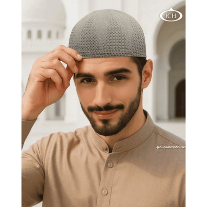 N07 light brown, Islamic prayer cap, angled view on model, refined textured pattern, comfortable fit, AL INAM CAP HOUSE