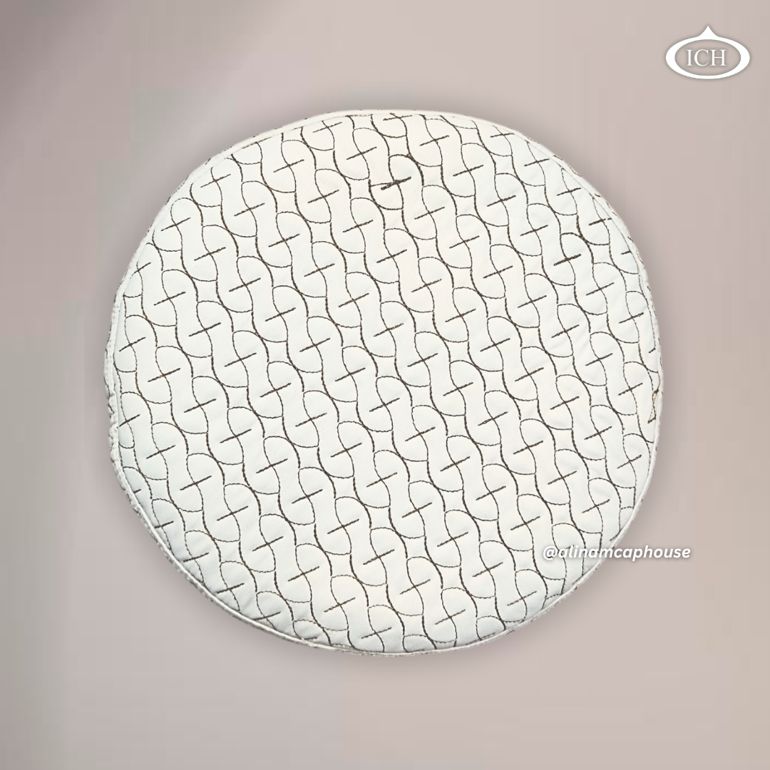 Top view of AL INAM ICH JJ style Islamic prayer cap featuring detailed brown embroidery on cream fabric