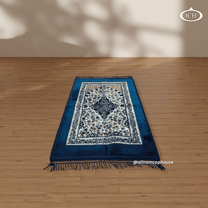 Al Inam prayer mat P05, angled shot of Islamic prayer rug, showing texture and design depth