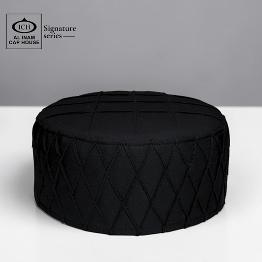 Front top view of AL INAM black Islamic Prayer Cap ICH-0000-A02 featuring premium breathable fabric, detailed stitching and traditional Muslim kufi cap design.