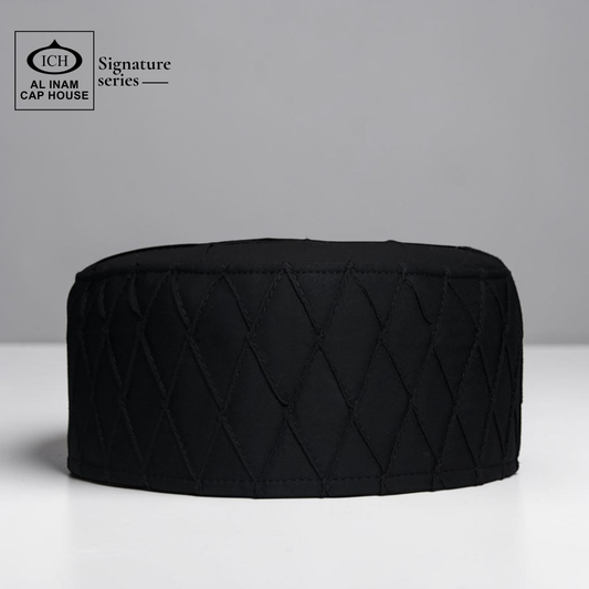 Front view of AL INAM black Islamic prayer cap showcasing lightweight comfortable fit for namaz, Jummah, Ramadan and daily Islamic wear.