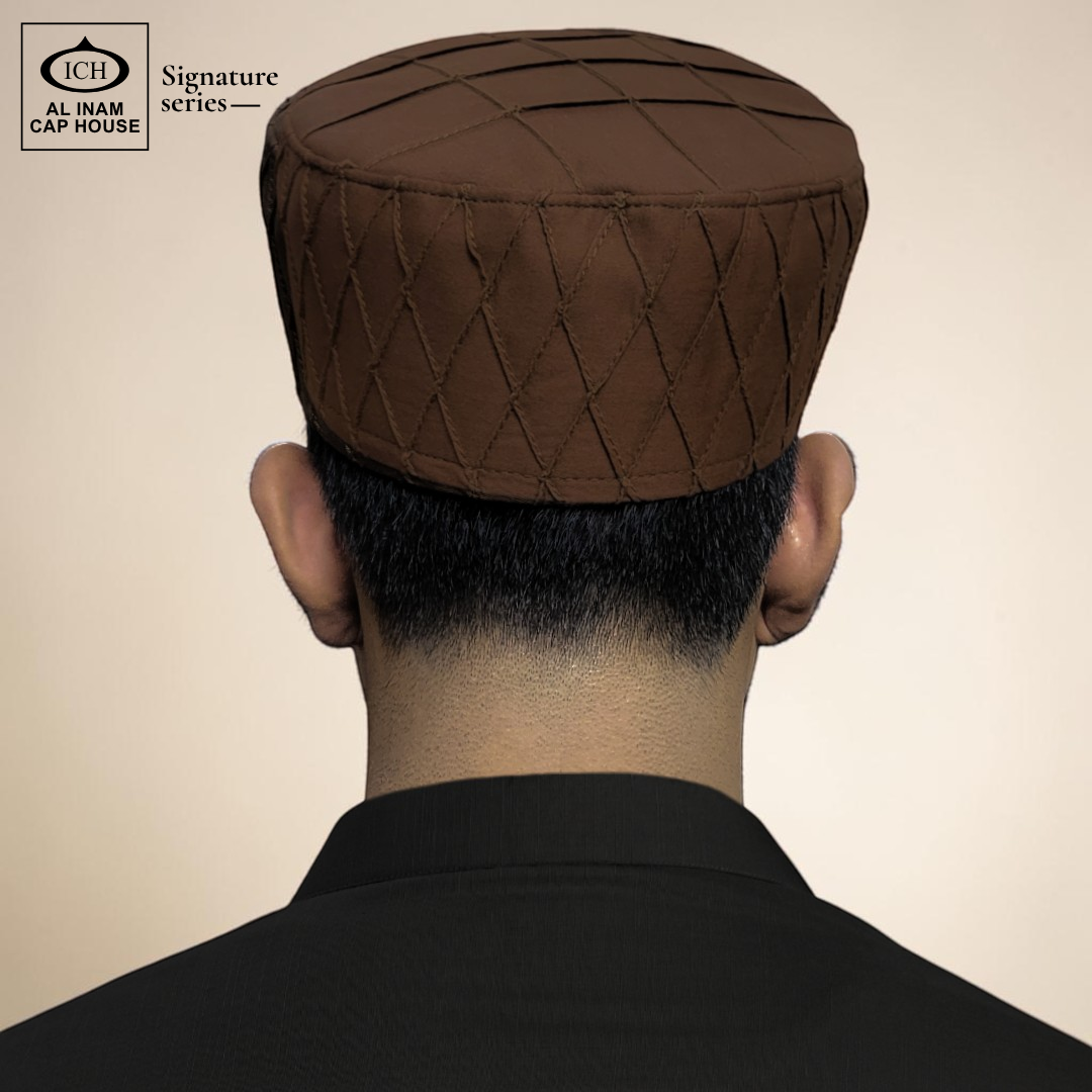 Model view of AL INAM brown Islamic prayer cap showing comfortable kufi cap fitting for daily use.