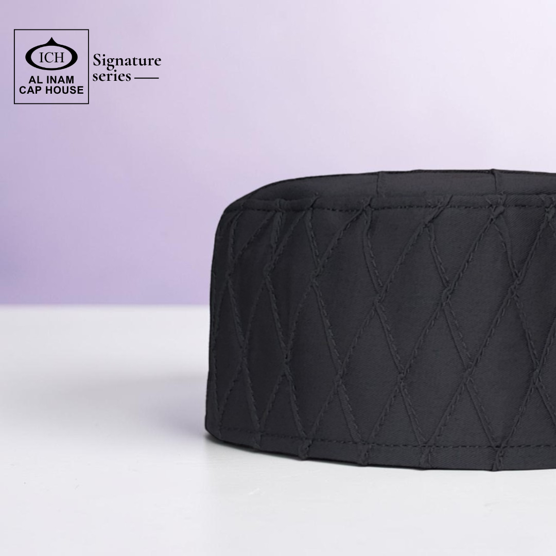 Side view of AL INAM grey Muslim prayer cap displaying elegant profile and premium craftsmanship.