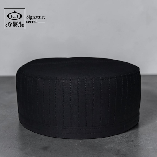 Top front view of AL INAM Signature Islamic Kufi Cap showing structured round shape, clean stitching and smooth fabric finish for comfortable and elegant wear.