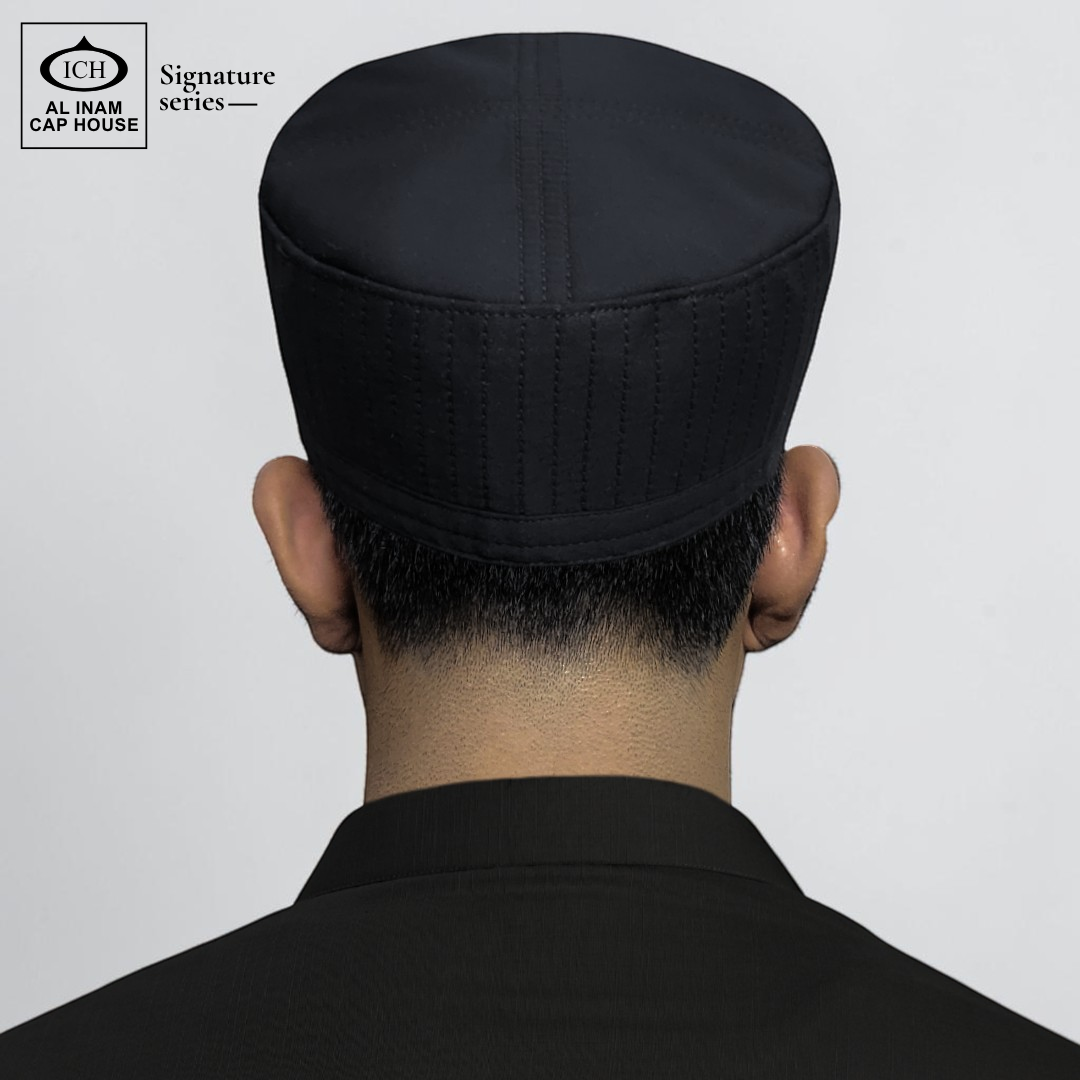 Back worn view of AL INAM Signature Islamic Prayer Cap on model showing proper head fit, secure hold and traditional kufi look for Muslim men.