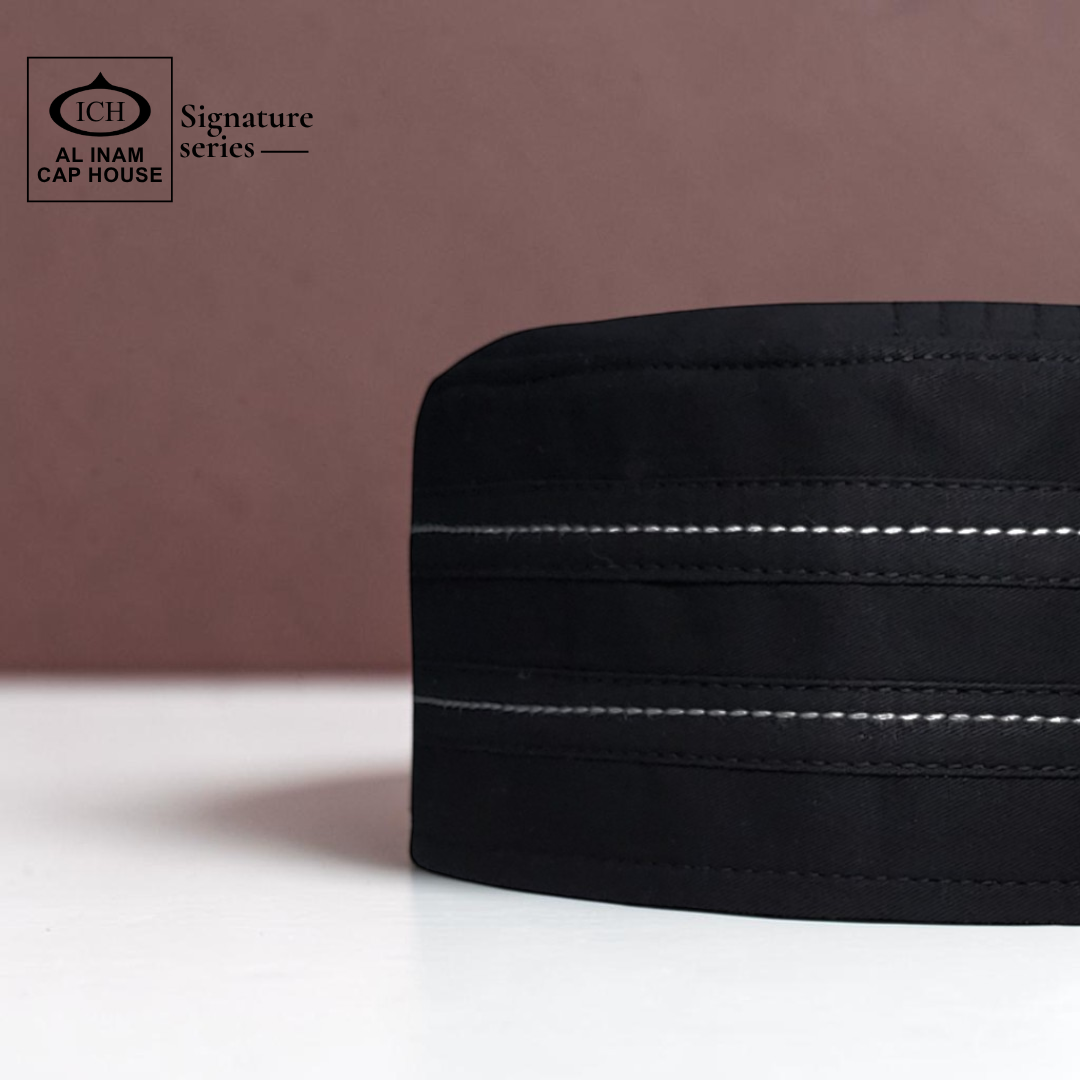 Side view of AL INAM Black Signature Islamic Prayer Cap highlighting clean stitching, structured fit and lightweight breathable fabric suitable for masjid and everyday use.