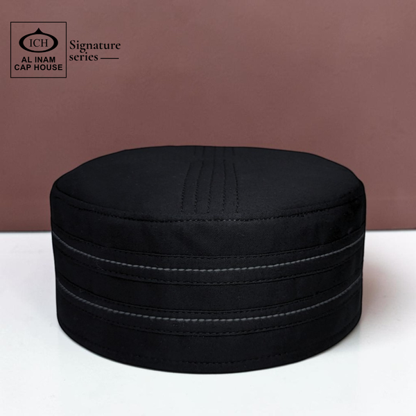 Top front view of AL INAM Black Islamic Kufi Cap showcasing structured round shape, smooth stitching and breathable fabric design for comfortable and elegant prayer wear.