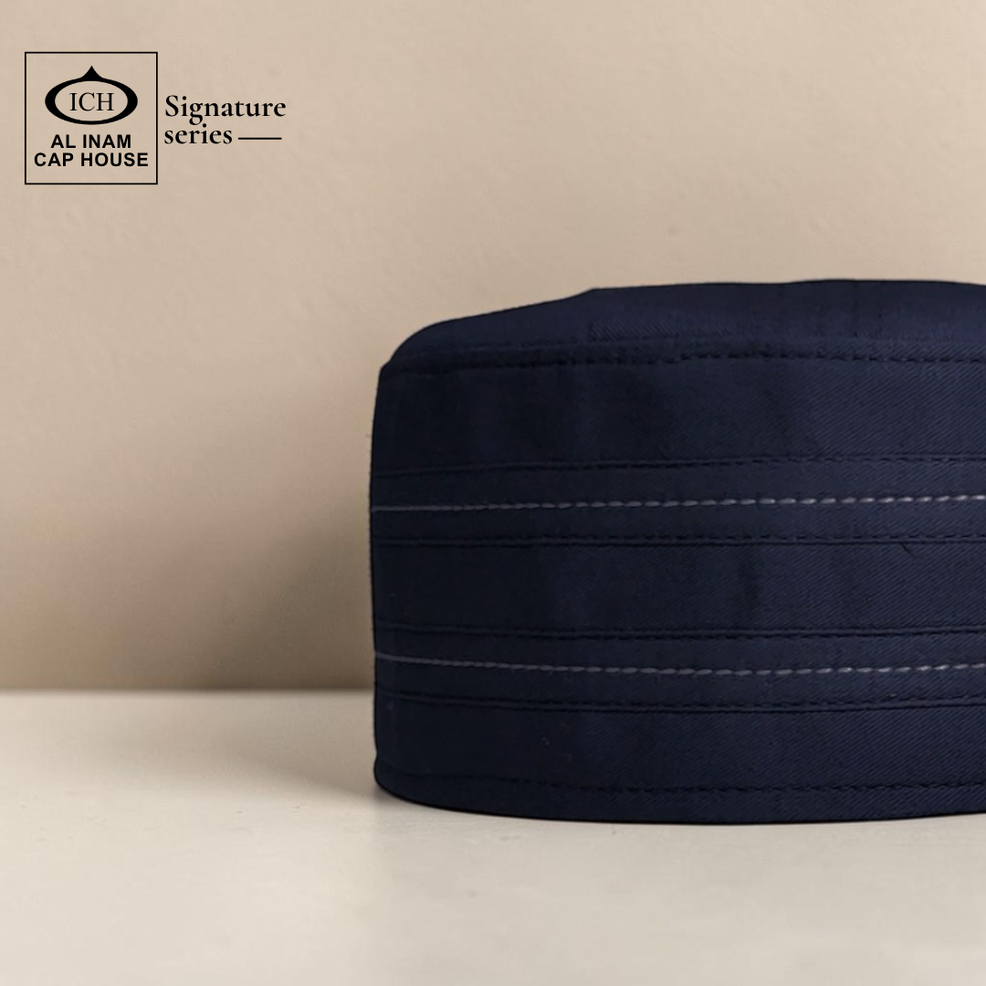 Side view of AL INAM Blue Signature Islamic Prayer Cap highlighting smooth finish, structured fit and lightweight breathable material ideal for masjid and everyday use.