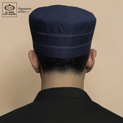 Back worn view of AL INAM Blue Islamic Prayer Cap on model showing secure fit, proper head coverage and traditional kufi look for Muslim men during prayer and daily wear.