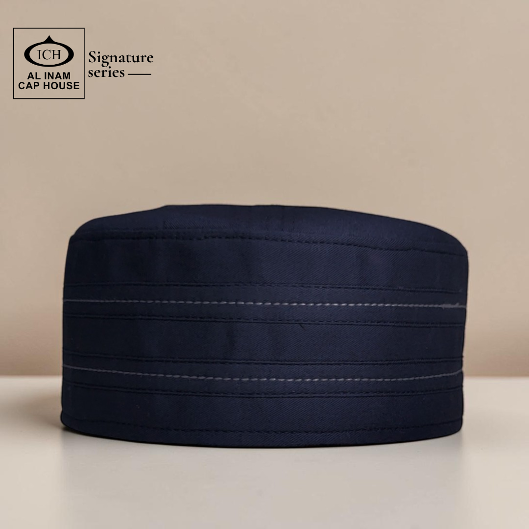 Front view of AL INAM Signature Islamic Prayer Cap ICH-0000-A04 in blue color crafted from soft breathable fabric, premium kufi skull cap for Muslim men, perfect for namaz, Jummah prayer, Eid and daily wear.