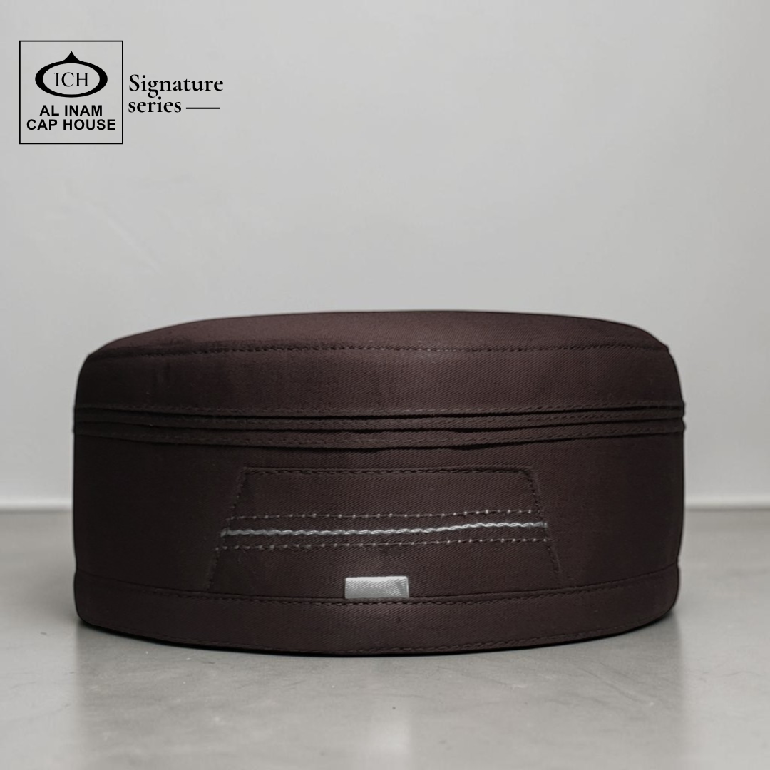 Front view of AL INAM Signature Islamic Prayer Cap ICH-0000-A05 in brown color made with soft breathable fabric, premium kufi skull cap for Muslim men, ideal for namaz, Jummah prayer, Eid and everyday wear.