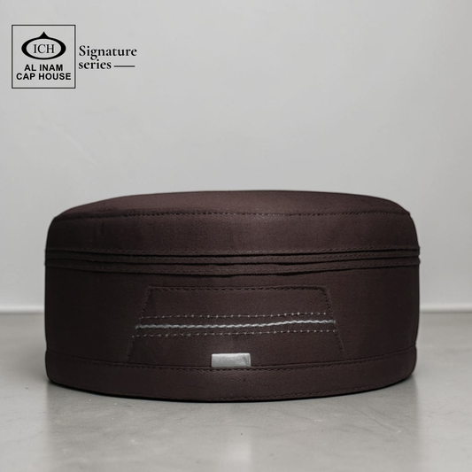 Front view of AL INAM Signature Islamic Prayer Cap ICH-0000-A05 in brown color made with soft breathable fabric, premium kufi skull cap for Muslim men, ideal for namaz, Jummah prayer, Eid and everyday wear.