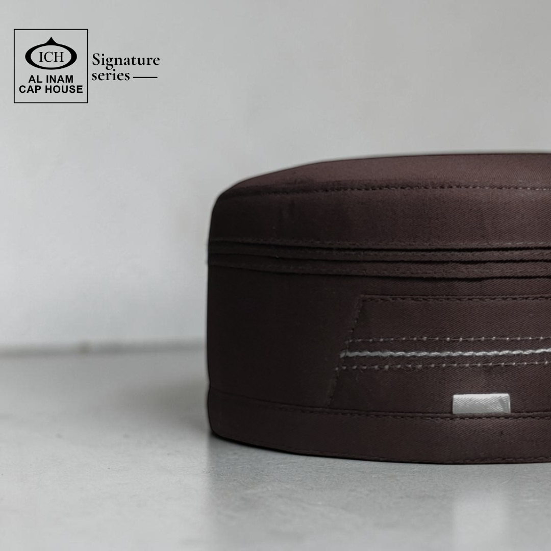 Side view of AL INAM Brown Signature Islamic Prayer Cap highlighting smooth finish, structured fit and lightweight breathable material suitable for masjid and daily use.