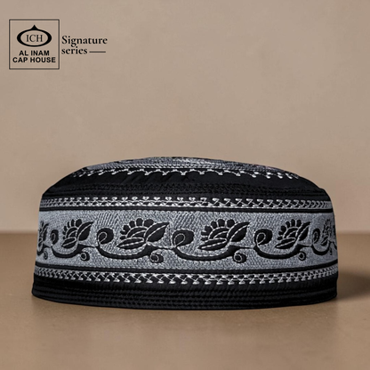 Front view of AL INAM Musqati Islamic Prayer Cap ICH-0000-A06 in black and white color combination, made with soft breathable fabric, premium kufi skull cap for Muslim men, ideal for namaz, Jummah, Eid and daily wear.