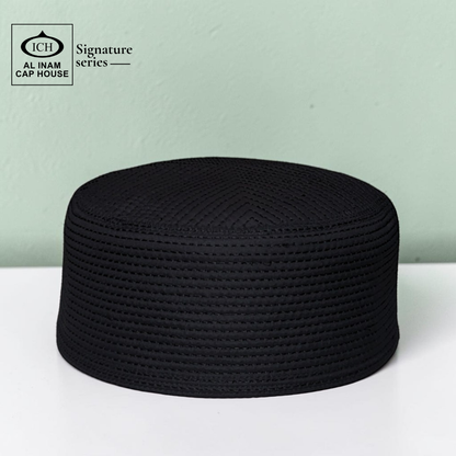 Front top view of AL INAM black Islamic Prayer Cap ICH-0000-A10 featuring premium breathable fabric, elegant stitching and traditional Muslim kufi cap design for namaz and daily wear.