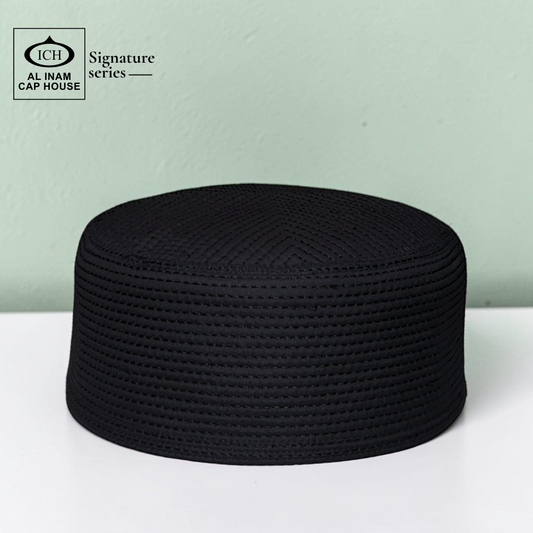 Front top view of AL INAM black Islamic Prayer Cap ICH-0000-A10 featuring premium breathable fabric, elegant stitching and traditional Muslim kufi cap design for namaz and daily wear.