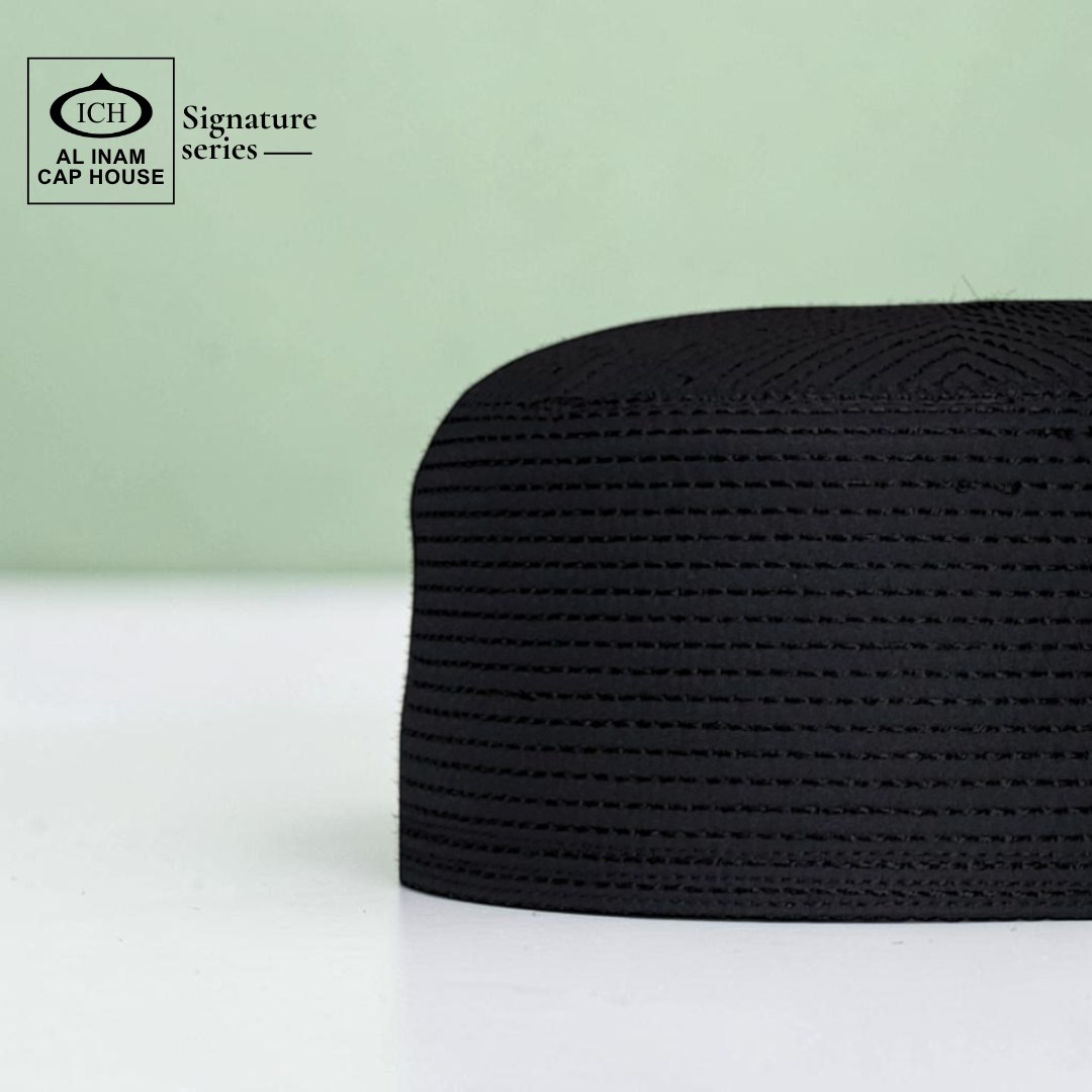 Side view of AL INAM black Islamic kufi cap displaying comfortable fit, breathable construction and elegant prayer cap profile.