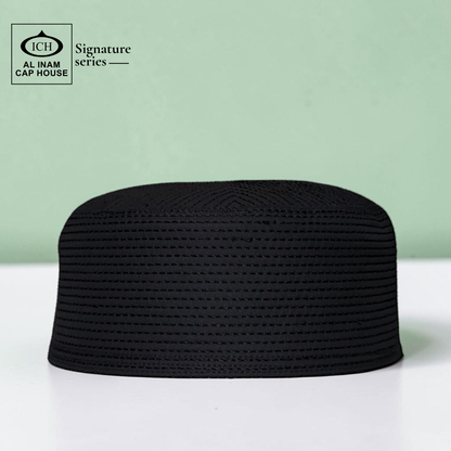 Front view of AL INAM black Islamic prayer cap showcasing lightweight comfort, premium craftsmanship and classic Muslim skull cap styling.