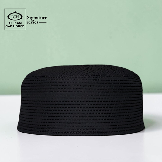 Front view of AL INAM black Islamic prayer cap showcasing lightweight comfort, premium craftsmanship and classic Muslim skull cap styling.