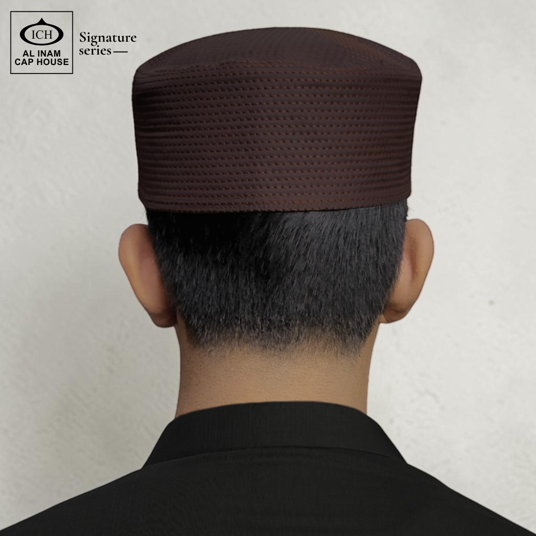 Model view of AL INAM brown Islamic prayer cap showing comfortable fitting and stylish Muslim cap appearance for daily use.