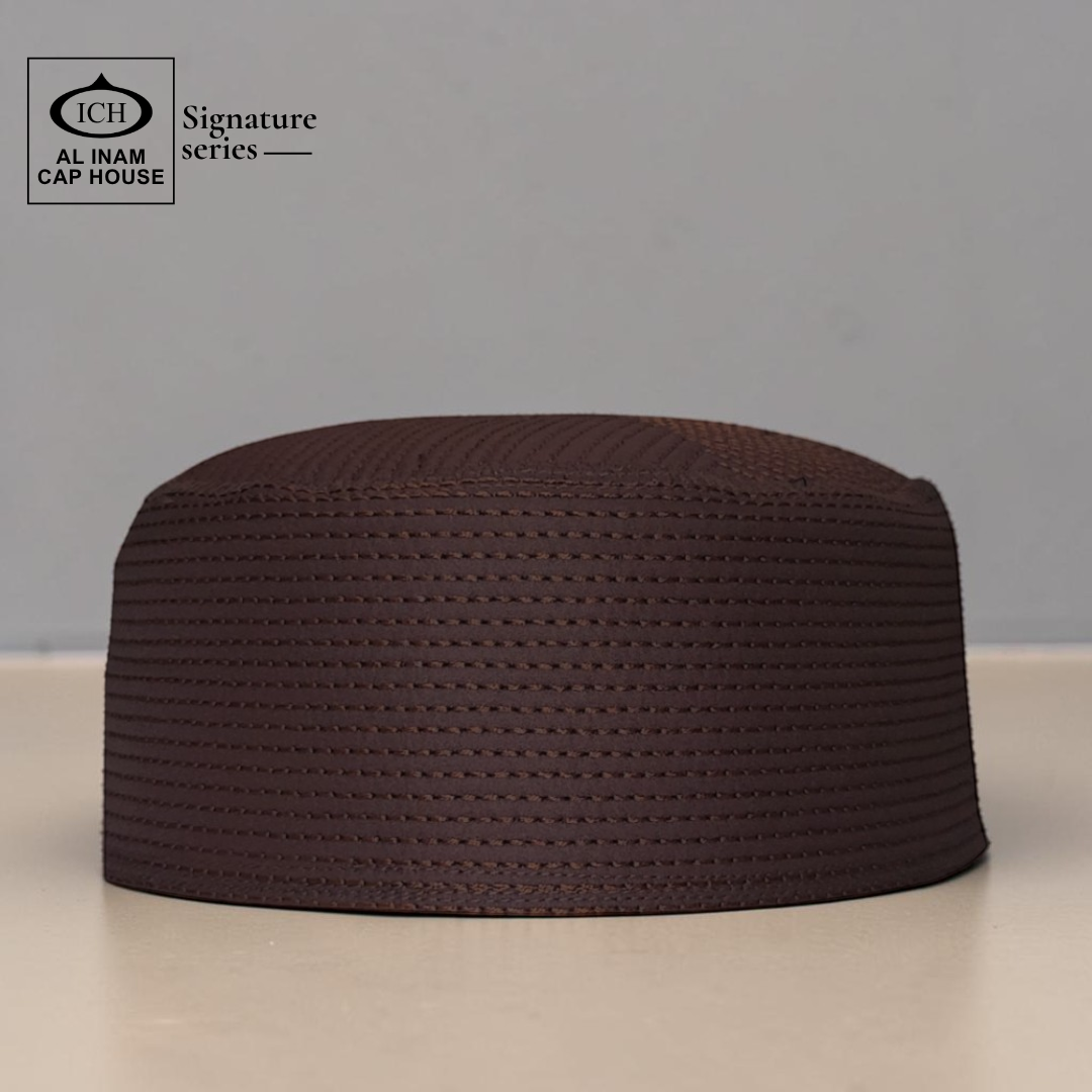 Front view of AL INAM brown Islamic prayer cap showcasing lightweight comfort and premium Muslim skull cap styling.