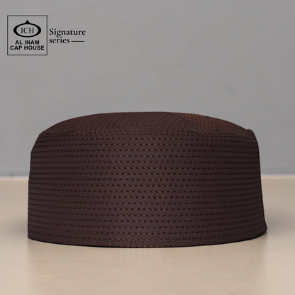 Front view of AL INAM brown Islamic prayer cap showcasing lightweight comfort and premium Muslim skull cap styling.