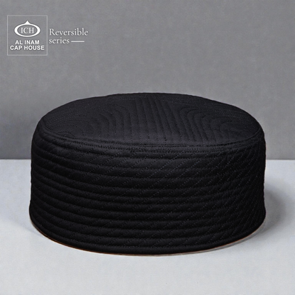 Front and top view of AL INAM Black Reversible Islamic Prayer Cap A-12 showcasing premium cotton construction, dual-sided reversible design, intricate embroidered detailing and breathable comfort for Muslim men during prayers and Islamic occasions.