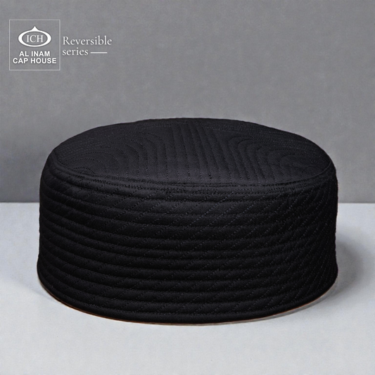 Front and top view of AL INAM Black Reversible Islamic Prayer Cap A-12 showcasing premium cotton construction, dual-sided reversible design, intricate embroidered detailing and breathable comfort for Muslim men during prayers and Islamic occasions.