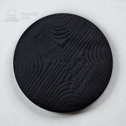 Top view of AL INAM Black Reversible Islamic Prayer Cap A-12 highlighting symmetrical embroidered craftsmanship, premium cotton fabric, reversible construction and lightweight kufi skull cap for daily Islamic wear.