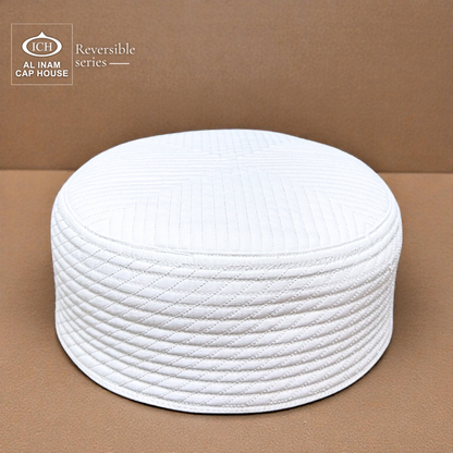 Front and top view of AL INAM White Reversible Islamic Prayer Cap A-12 showcasing premium cotton construction, reversible dual-sided design, intricate embroidered detailing and breathable comfort for Muslim men during daily prayers and special Islamic occasions.