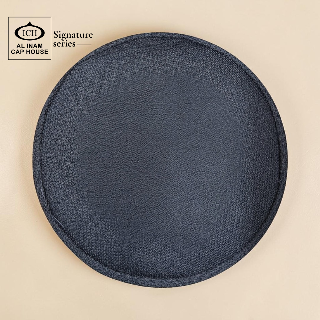 Top view of AL INAM Black and White Islamic prayer cap featuring clean pattern design, lightweight breathable cotton and flexible fit.