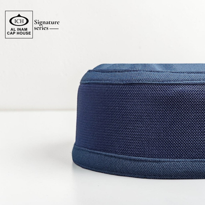 Side view of AL INAM Blue kufi cap showing flexible fit, neat stitching and comfortable wear.