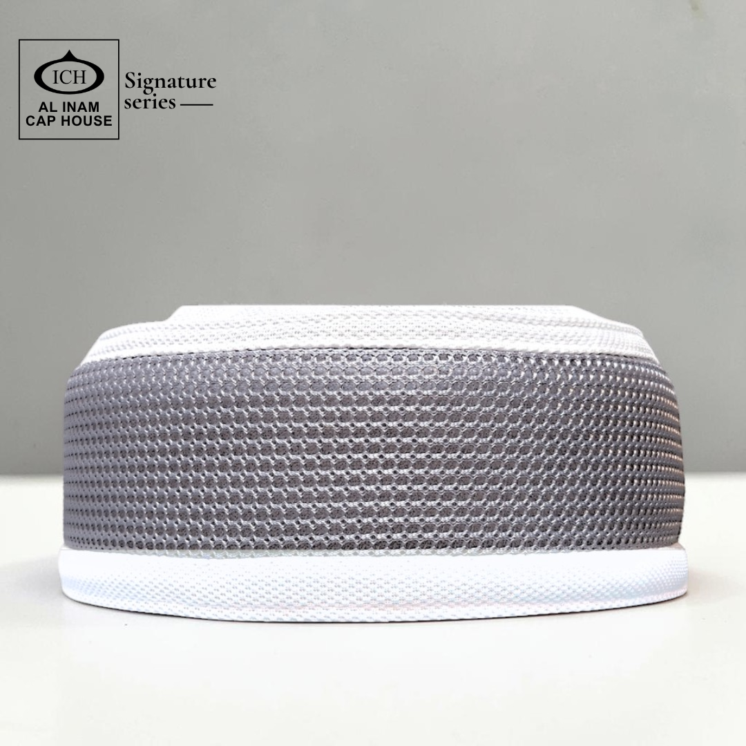 Front view of AL INAM Grey and White Islamic prayer cap with breathable cotton fabric and stretchable free size kufi design.