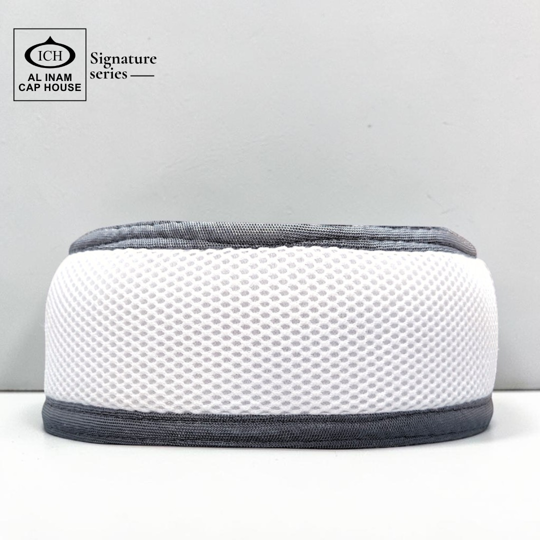 Front view of AL INAM White and Light Gray Islamic prayer cap with breathable cotton fabric, stretchable free size kufi skull cap for Muslim men