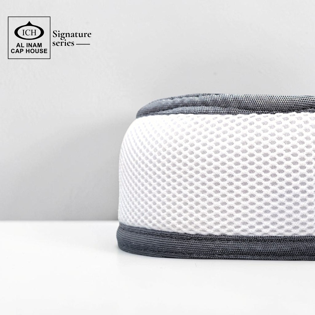 Side profile of AL INAM White and Light Gray kufi cap showing flexible fit, soft cotton material and comfortable wear.
