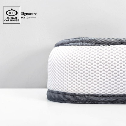 Side profile of AL INAM White and Light Gray kufi cap showing flexible fit, soft cotton material and comfortable wear.