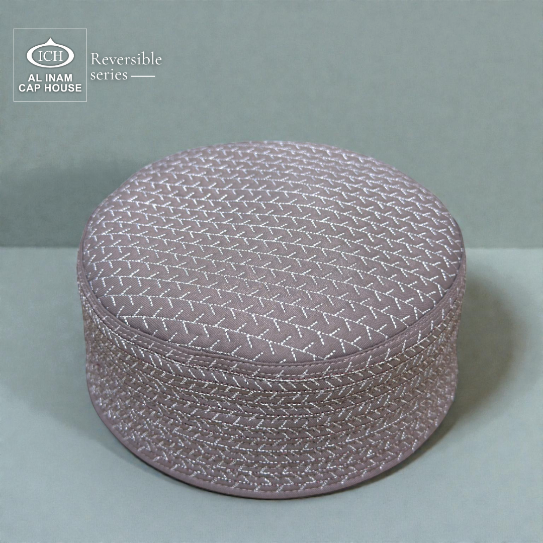 Top front angle of AL INAM ICH Grey Reversible Islamic Kufi Cap showcasing fine stitching, structured traditional pattern, soft breathable material, stylish skull cap for masjid and Islamic gatherings.