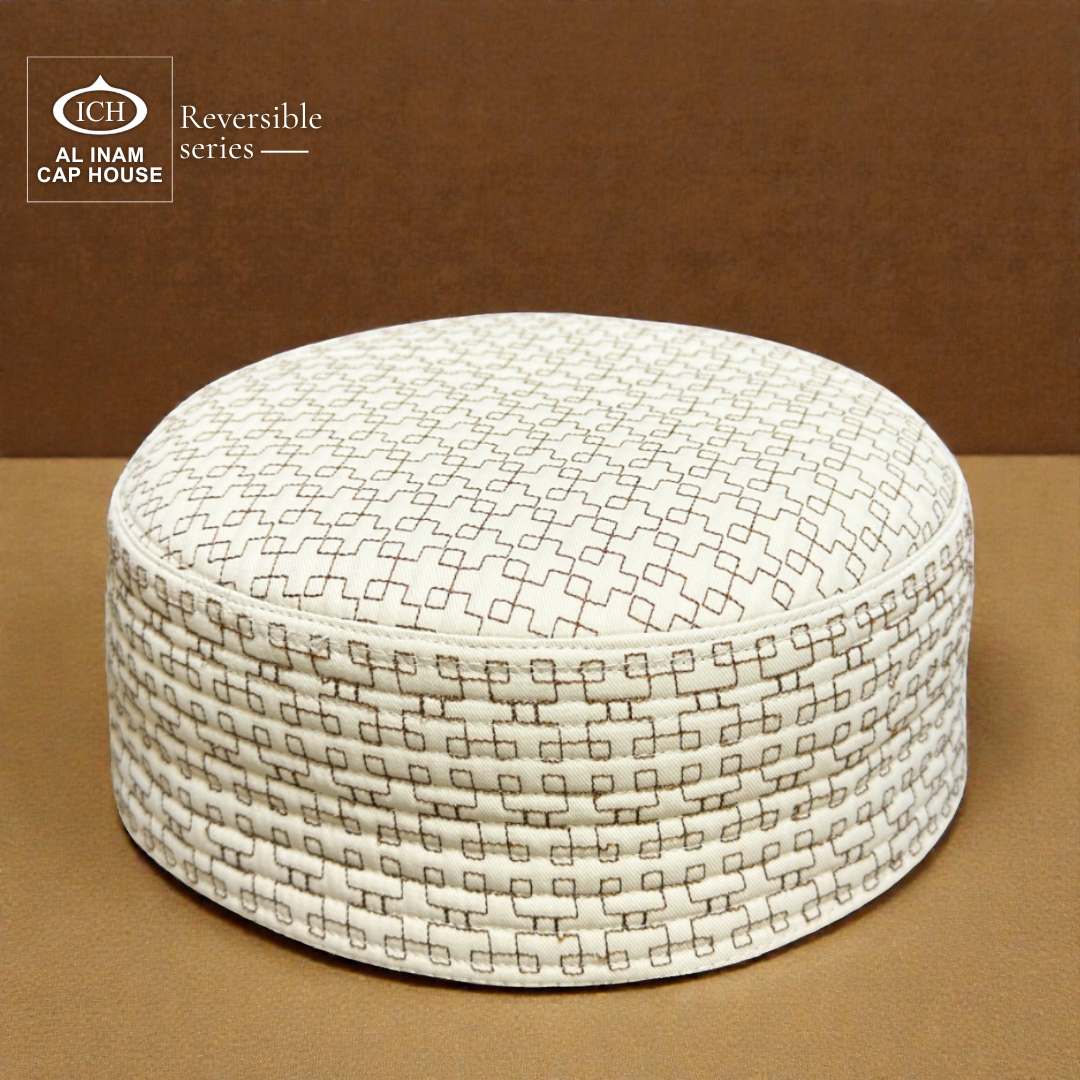 Top front perspective of AL INAM ICH Reversible Islamic Kufi Cap featuring structured traditional pattern, fine stitching craftsmanship, soft breathable material, ideal skull cap for masjid and special Islamic occasions.