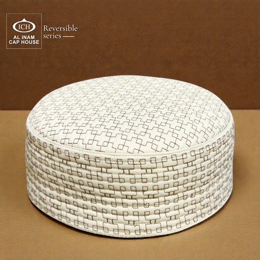 Top front perspective of AL INAM ICH Reversible Islamic Kufi Cap featuring structured traditional pattern, fine stitching craftsmanship, soft breathable material, ideal skull cap for masjid and special Islamic occasions.