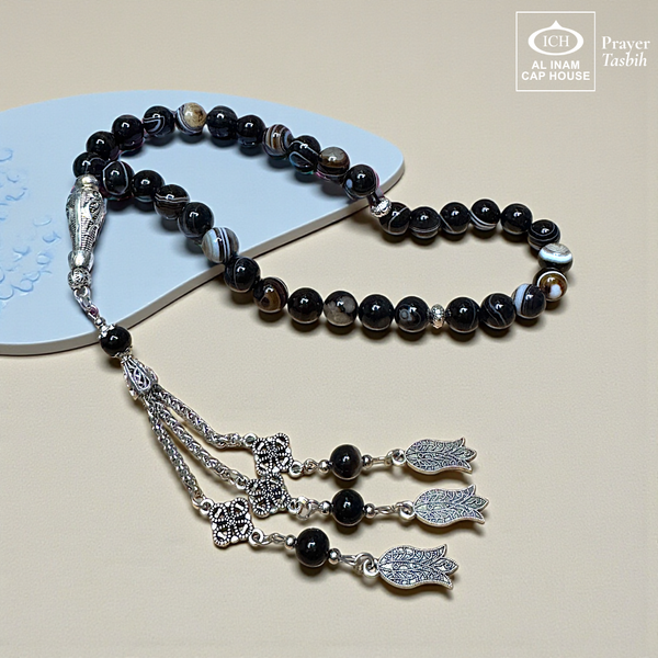 Main display view of AL INAM Aqeeq Hakik Tasbih ICH-0000-T14 handcrafted with genuine agate stone beads featuring deep dark earthy tones and natural banded patterns, premium Islamic prayer beads for dhikr, duas, Ramadan, Hajj, Umrah and daily spiritual use.