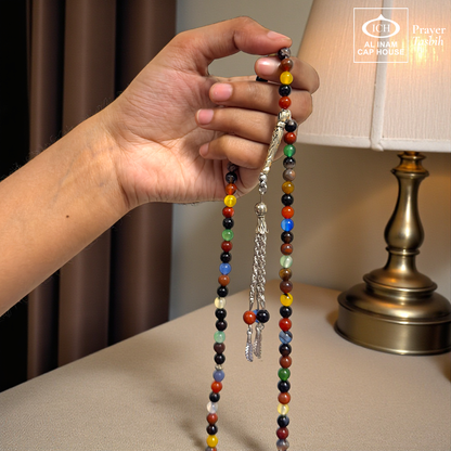 Spiritual use view of AL INAM AQEEQ Tasbih crafted with genuine agate beads and silver toned Islamic tassel, elegant zikr accessory ideal for Ramadan gifting, Eid, Hajj, Umrah and spiritual gatherings.