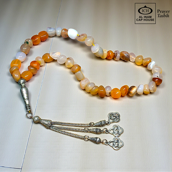 Main display view of AL INAM AQEEQ Tasbih ICH-0000-T17 handcrafted with genuine agate stones featuring honey, amber, soft white and earthy tones, premium Islamic prayer beads for dhikr, duas, Ramadan, Hajj, Umrah and daily spiritual use.